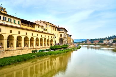 river arno next to art museum "uffizi gallery" in florence in italy / seen from famous "ponte vecchio"