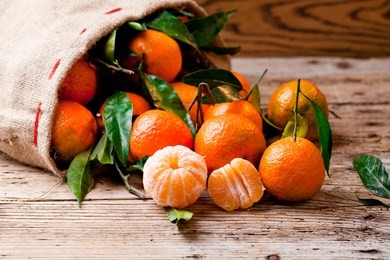 fresh picked mandarins on wooden background