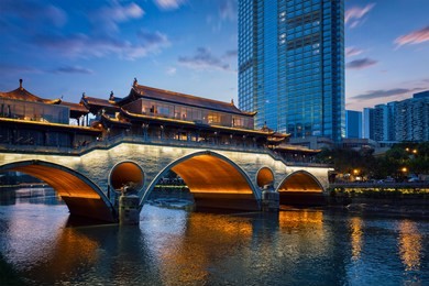famous landmark of chengdu - anshun bridge over jin river illuminated at night, chengdue, sichuan , china
