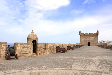 watchtower and cannons on the fortress wall of skala du port, essaouira, morocco, north africa 