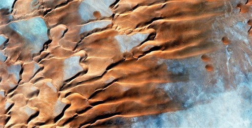 series of abstract photographs of the deserts of africa from the air,