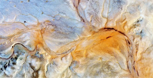 series of abstract photographs of the deserts of africa from the air,