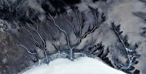 series of abstract photographs of the deserts of africa from the air,