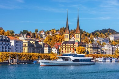 morning view of historic zurich city center with famous fraumunster and grossmunster churches and river limmat at lake zurich on a sunny day with clouds in summer, canton of zurich, switzerland
