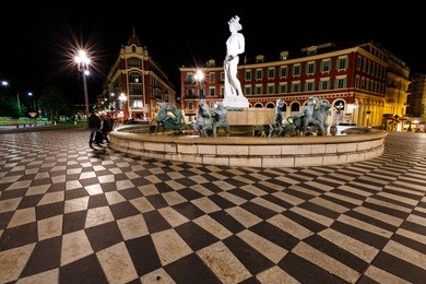 the fontaine du soleil on place massena at night, nice, french riviera, france