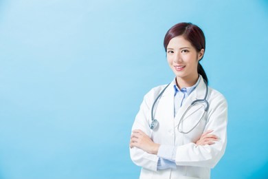 woman doctor smile to you on the blue background
