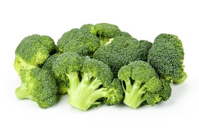 a lot of broccoli inflorescence on white background isolated. space for text