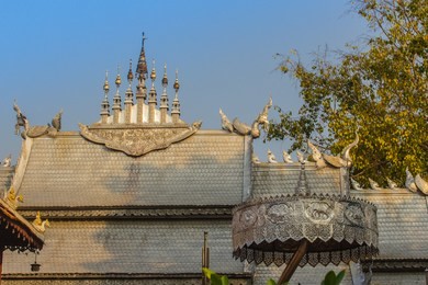 amazing temple silver roof ridge design at wat sri suphan, chiang mai, thailand. wat srisuphan also known as the silver temple because of its impressive hand crafted silver ordination hall decoration.