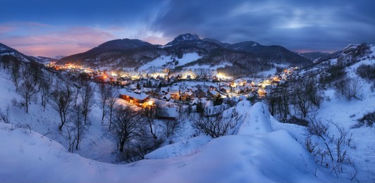 landscape with village at winter night, panorama