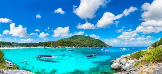 panorama of racha (raya) resort island near phuket island, thailand in a summer day