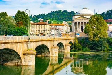 vittorio emanuele i bridge on po river and great mother of god cathedral including the memorial to the fallen in world war i, turin, piedmont, italy