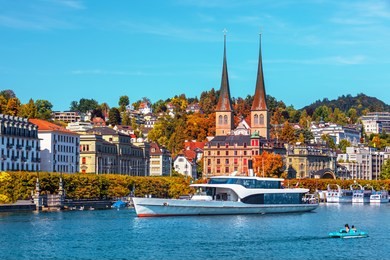 morning view of historic zurich city center with famous fraumunster and grossmunster churches and river limmat at lake zurich on a sunny day with clouds in summer, canton of zurich, switzerland
