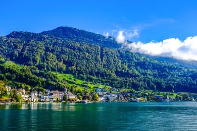 shoreline of the lake lucern with weggis on the left and the mount rigi on the right side.