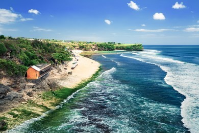 bali seascape with huge waves at beautiful hidden white sand beach. bali sea beach nature, outdoor indonesia. bali island landscape. summer holidays at ocean beach. travel vacation in indonesia beach