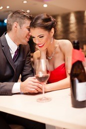 young men whispers to his girlfriend, couple in love