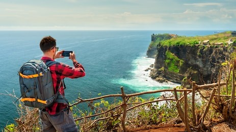 view of uluwatu cliff with pavilion and blue sea in bali, indonesia