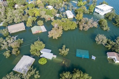 tons of homes totally destroyed , flooded and submerged under water , historic flooding aerial drone view above homes and houses central texas flooding severe weather and climate change flooding