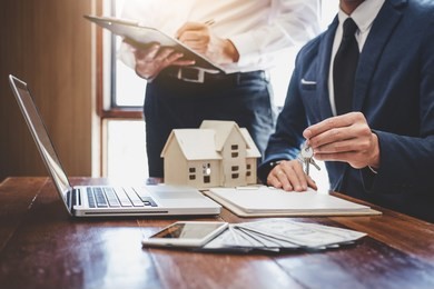 real estate agent and sales manager team analysis pricing of rental lease contract of sale purchase agreement, concerning mortgage loan offer for and house insurance.