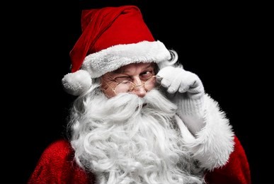 man in santa claus costume winking 