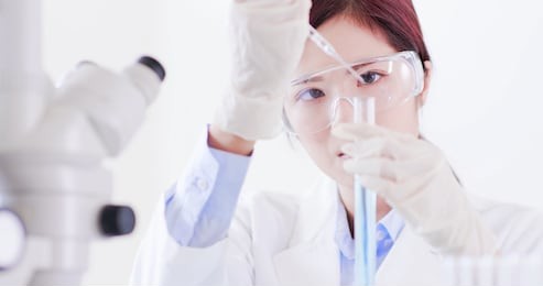 woman scientist take test tube in the laboratory