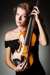 woman performer with violin in studio