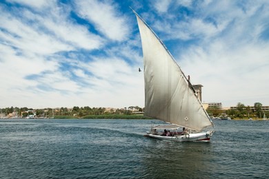 sailboat or felucca with folded sail  in thenile river, egypt  aswan