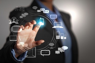 business person pushing symbols on a touch screen interface