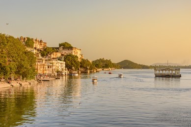 panoramic view of city of lakes udaipur with lake pichola from ambrai ghat,rajasthan, india.