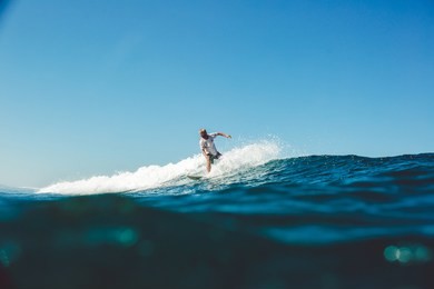 surfer in the ocean on the island of sumbawa