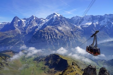 panoramic view from  schilthorn summit with cable car, in the bernese alps of switzerland. 