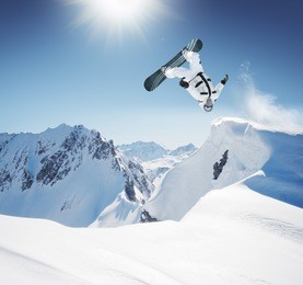 snowboard jumping in high mountains