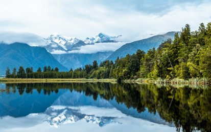 beautiful landscape of the mountain and the reflection on the lake. lake matheson, fox glacier, new zealand.