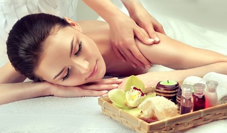 massage and body  care. spa body massage   woman hands treatment. woman having massage in the spa salon for beautiful girl
