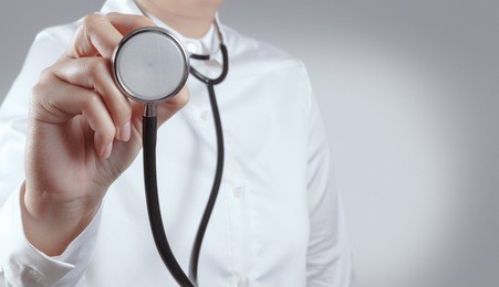 doctor with a stethoscope in the hands