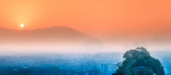 arial view of guilin, li river and karst mountains yangshuo during sunrise with sun rays guangxi province, china