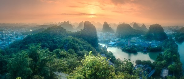 arial view of guilin, li river and karst mountains yangshuo during sunrise with sun rays guangxi province, china