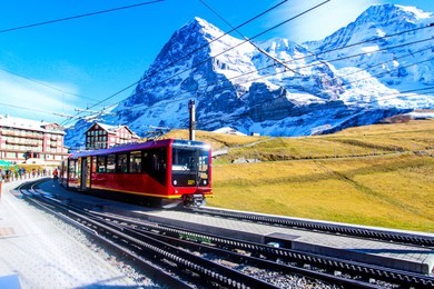 swiss train at kleine scheidegg station in jungfrau area.oct 18, 2016: view of a jungfrau railways train, connecting kleine scheidegg to jungfraujoch. switzerland.