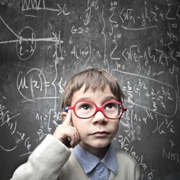 thinking child with a blackboard in the background