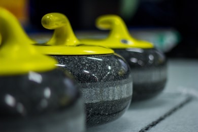 curling stones on ice