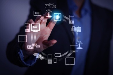 business person pushing symbols on a touch screen interface