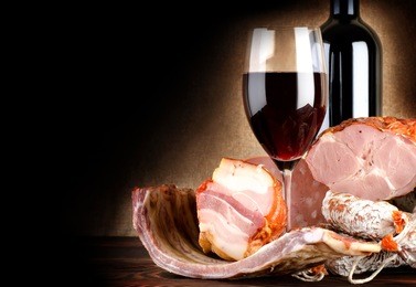 wine and meat on an old canvas