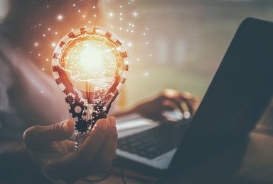 business women hand holding light bulb, concept of new ideas with innovation and creativity / soft focus picture / vintage concept	