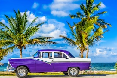 havana, cuba - june 30, 2017: hdr - american blue classic car parked on the malecon near the beach in havana cuba - serie cuba reportage