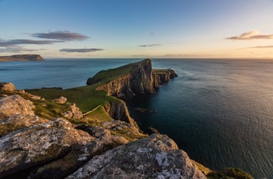 neist point lighthouse, isle of skye, scotland at sunset