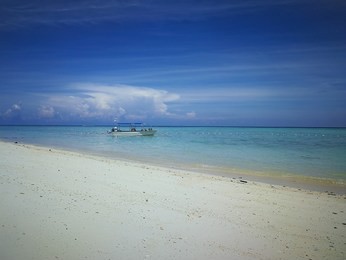 mantanani island, kota belud, kota kinabalu, sabah, malaysia - november 01, 2018, view of mantanani island with blue sky and clear water 