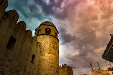 photo of mosque in sousse. medieval architecture of famous african city. vivid picture of ancient religious building - one of the main attractions in sousse, tunisia.