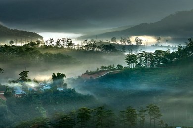 beautiful images of the radiant dawn as the paradise with reflecting rays in the hills and mountains in the fanciful clouds in lam dong province, vietnam.