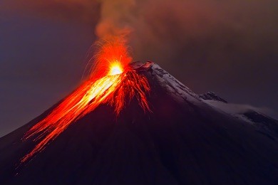 eruption of the volcano with molten lava flowing on the slopes (tungurahua, ecuador)
