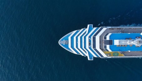 aerial view of beautiful white cruise ship above luxury cruise concept tourism travel on holiday vacation time.