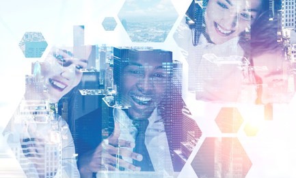 cheerful african american businessman and his two beautiful colleagues working with laptop over cityscape background with hexagonal pattern foreground. toned image double exposure